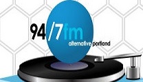 94.7fm table logo1A