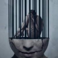 CONFINED IN SHACKLES 